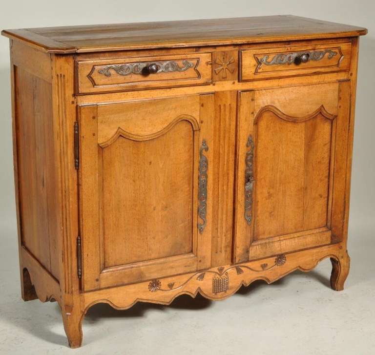 shaped bread board top over two drawers over a pair of paneled doors raised on cabriole legs with a carved and shaped apron. Provenance: Mill House Antiques Label.