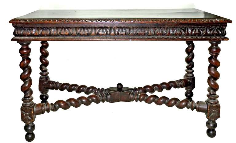featuring a rectangular top over a two drawer frieze and raised on sugar twist legs connected with turned stretchers.