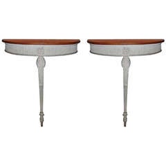 Pair English Mahogany, Painted, and Carved Demi-Lune Console Tables