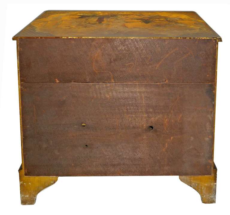 Second half of the 19th century; rectangular top over a central drawer and cabinet door flanked with tapering drawers; raised on bracket feet. Decorated throughout with chinoiserie stylized motifs.