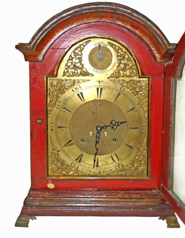 Red Lacquered Chinoiserie Bracket Clock, Case and Face Made by the firm of Markwick - Markham; working in London 1730-1780; with a domed top over a conforming glazed door raised on brass ogee bracket feet. The associated movement dates to 1900, and