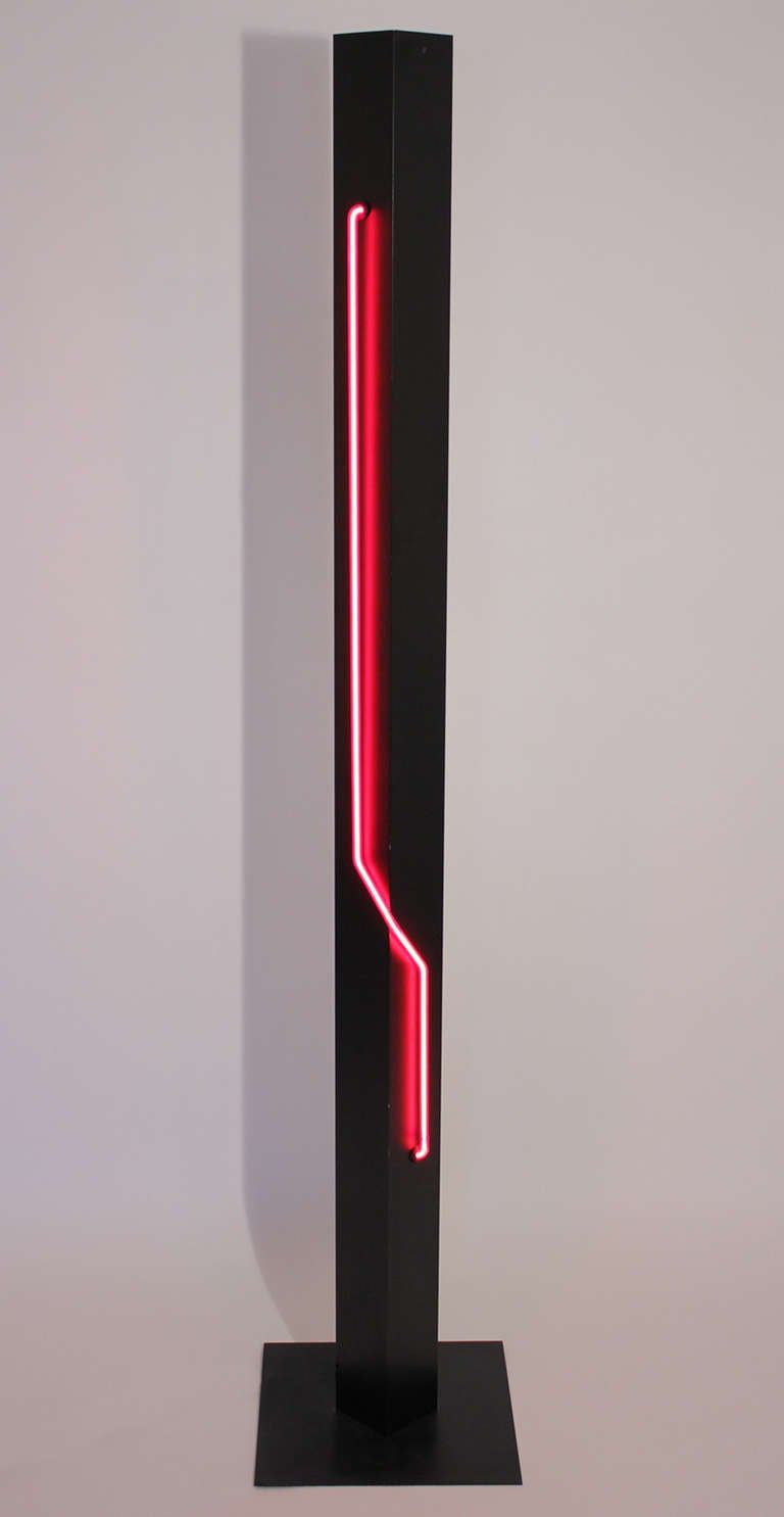 A dramatic torchiere floor lamp with red neon on black powder coated steel designed by Rudi Stern & Don Chelsea for George Kovacs. Independent knobs for each light: on/off for neon and dimmer for uplight.

Base: 14