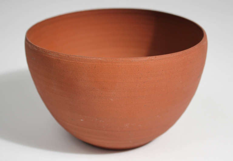 An extremely well thrown, thin walled and unglazed ceramic bowl by renown California ceramist Laura Andreson. An early example from 1944, hand signed and dated on base in pencil.