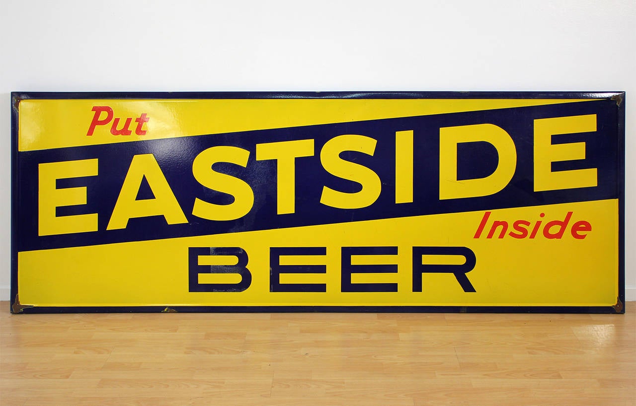 Large vintage porcelain advertising sign for the legendary Eastside Beer in Los Angeles, CA. Very clean example considering the age with minor surface wear and minor losses at the four mounting corners, circa 1930s.