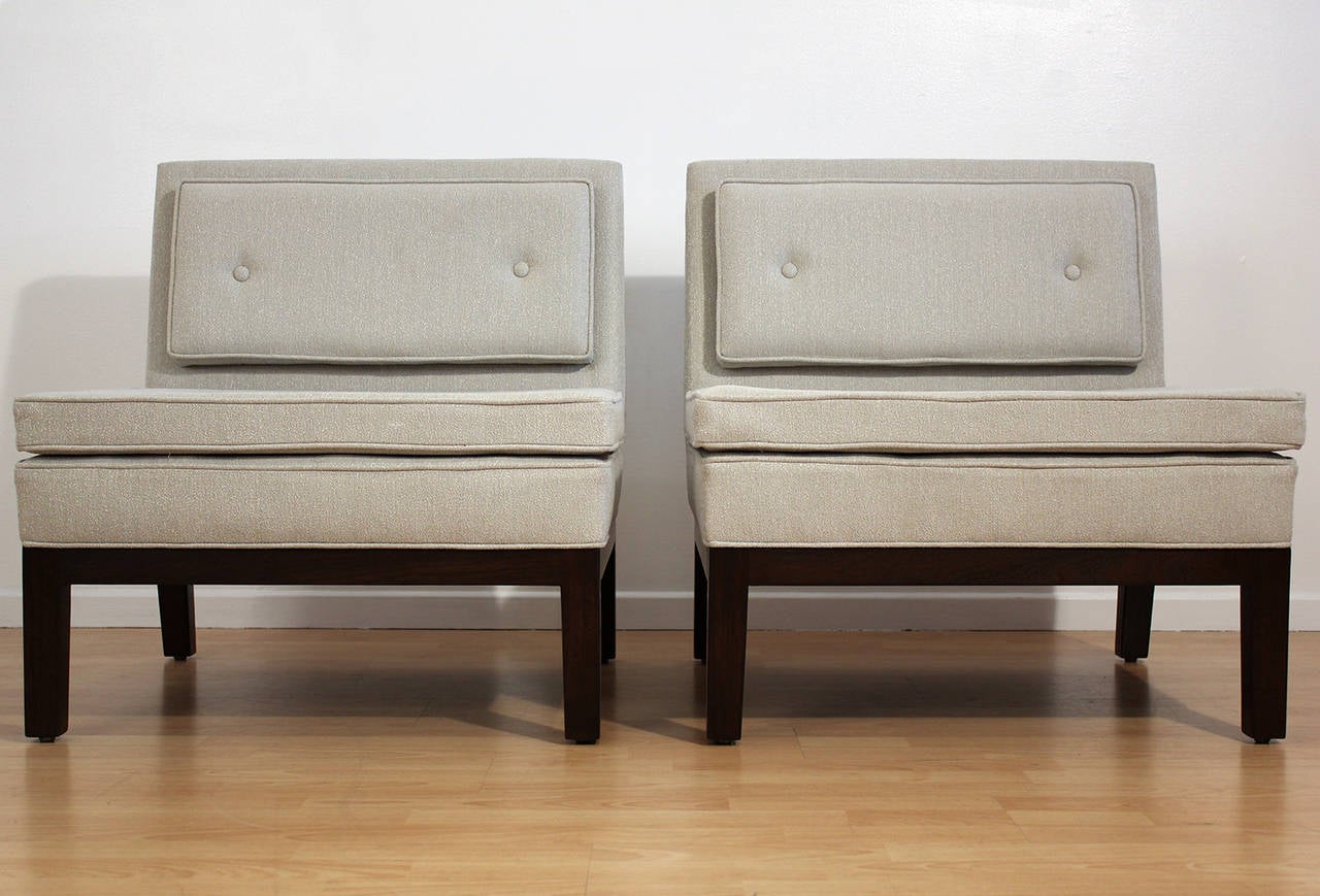 Pair of fully restored vintage 1950s slipper lounge chairs upholstered in a lightly textured very pale mint colored fabric. Designed by Michael Taylor for Baker Furniture Company.