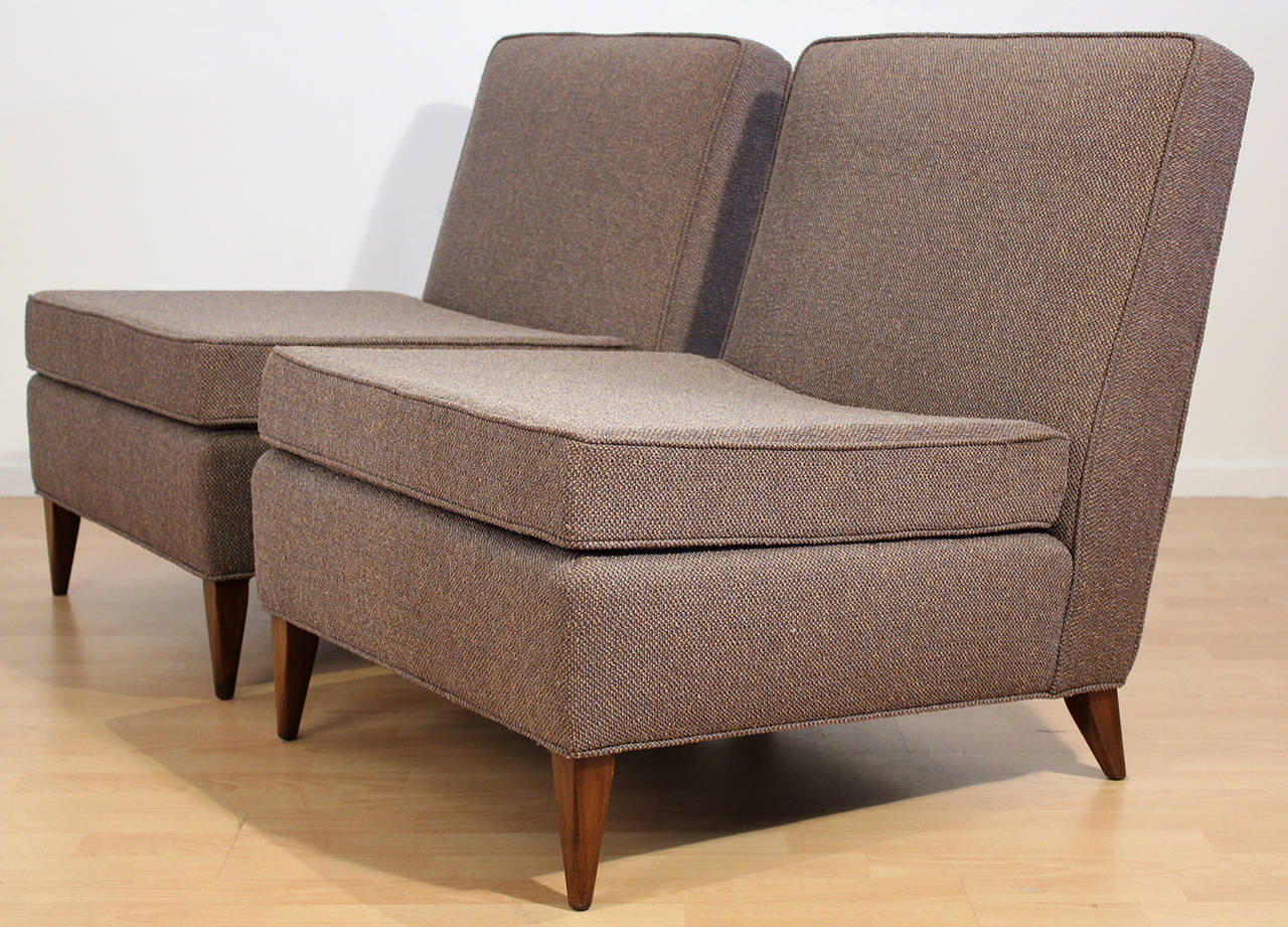 Pair of fully restored vintage 1950's Harvey Probber slipper lounge chairs upholstered in a lightly textured medium brown/tan fabric.