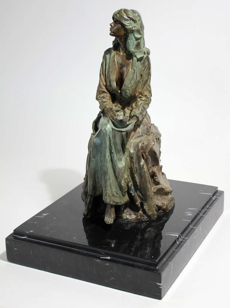 Bronze figurative sculpture mounted on solid marble base 