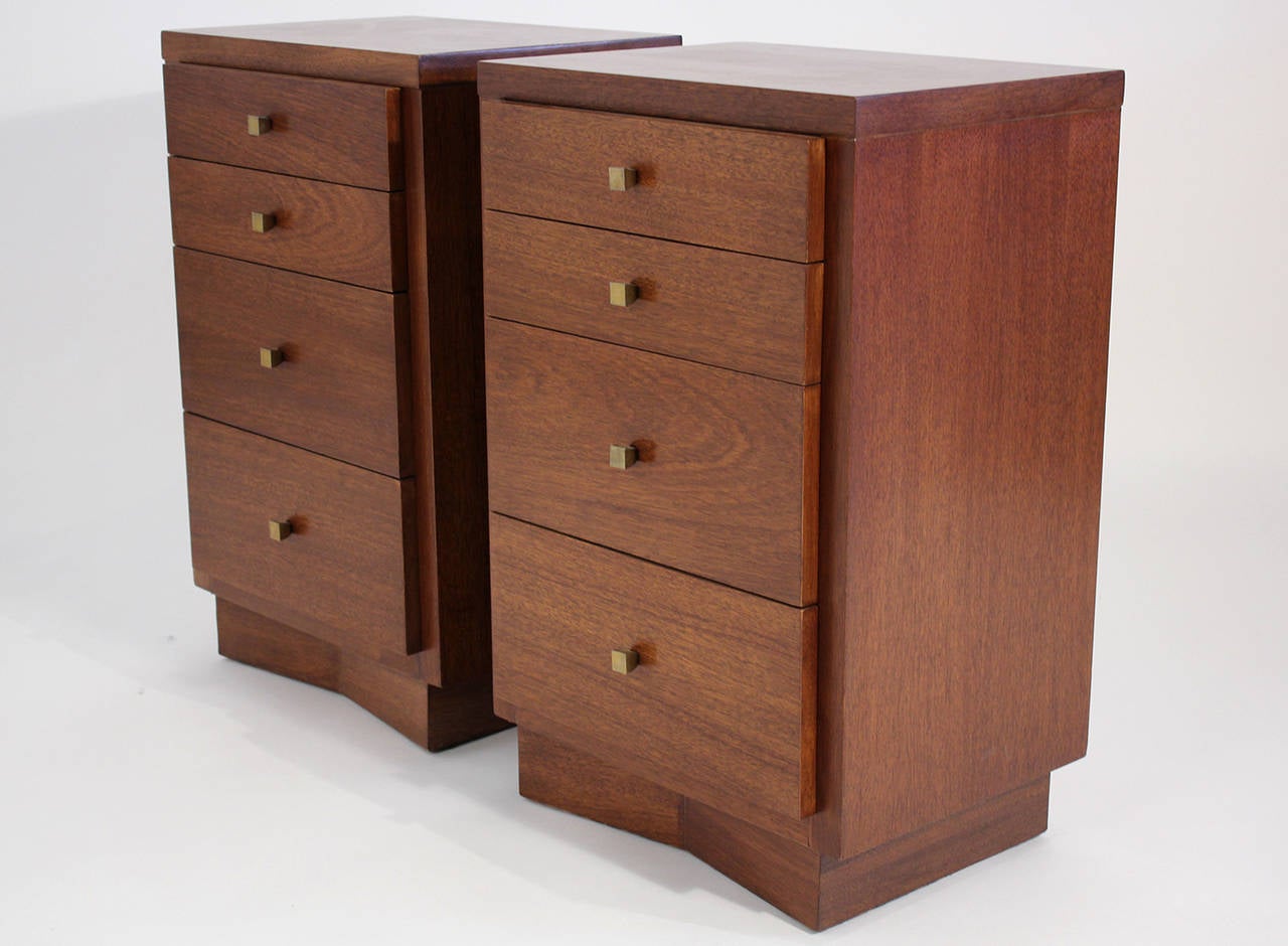 Pair of simple modernist tall four-drawer walnut nightstands or cabinets by American of Martinsville.

Excellent vintage all-original condition with minor wear to drawer pulls.

Measures: 29.25
