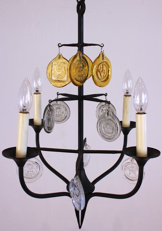 Four arm glass and wrought iron chandelier designed by Erik Hoglund. Glass done at Boda Nova Glassworks and the iron work was done at Axel Stromberg Ironworks. Total length of chandelier is 22 inches. Comes with the original hanging chain as seen in