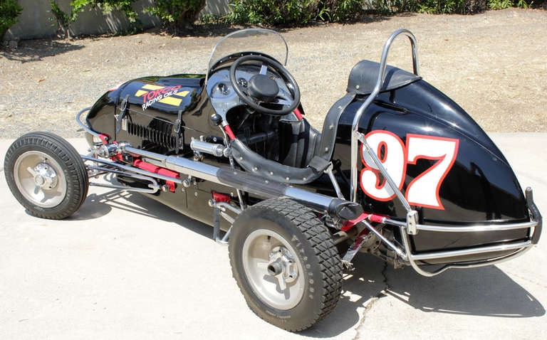 Originally owned by Bob Clawson and driven by Johnny Moorhouse, this 1947 Kurtis Kraft Midget with a V8-60 Power Plant Motor raced for Torco Oil in the Southern California Circle Track Circuit from the late 1940's to the 1950's . The car was fully