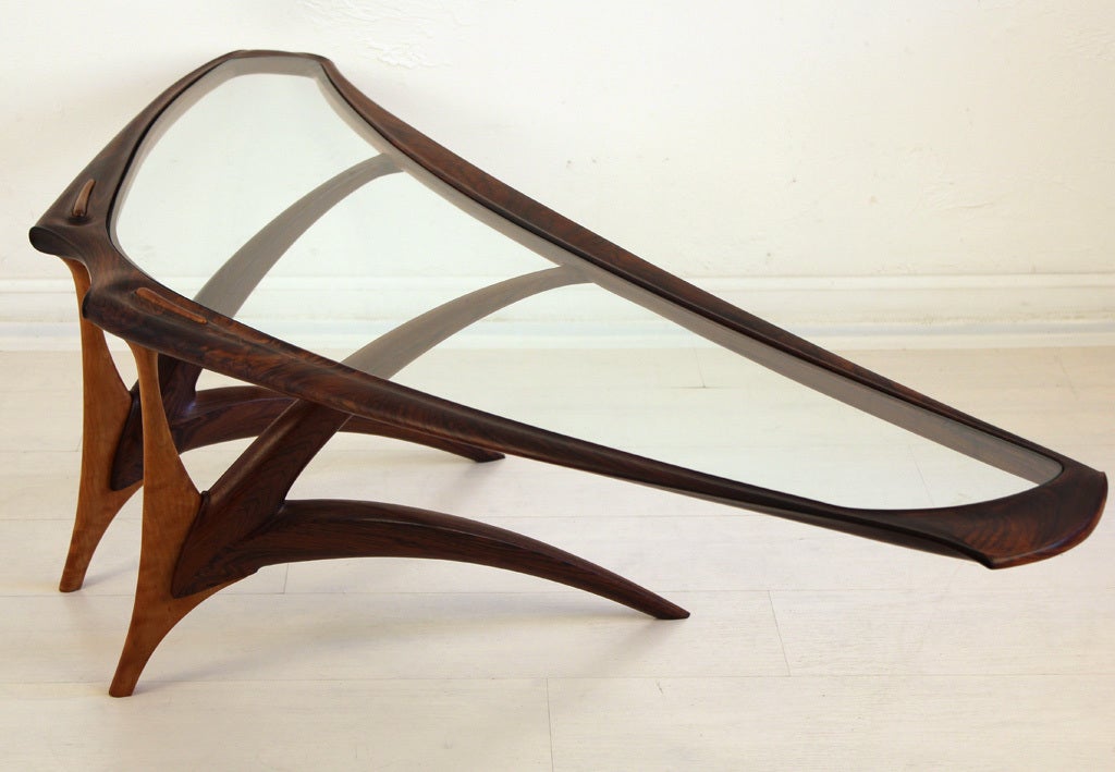 Unique sculptural studio cocktail table. This is a functional piece of art. It depicts a Mantaray in motion. It is all hand crafted of Palisander Rosewood and Tiger Maple. It has amazing detail