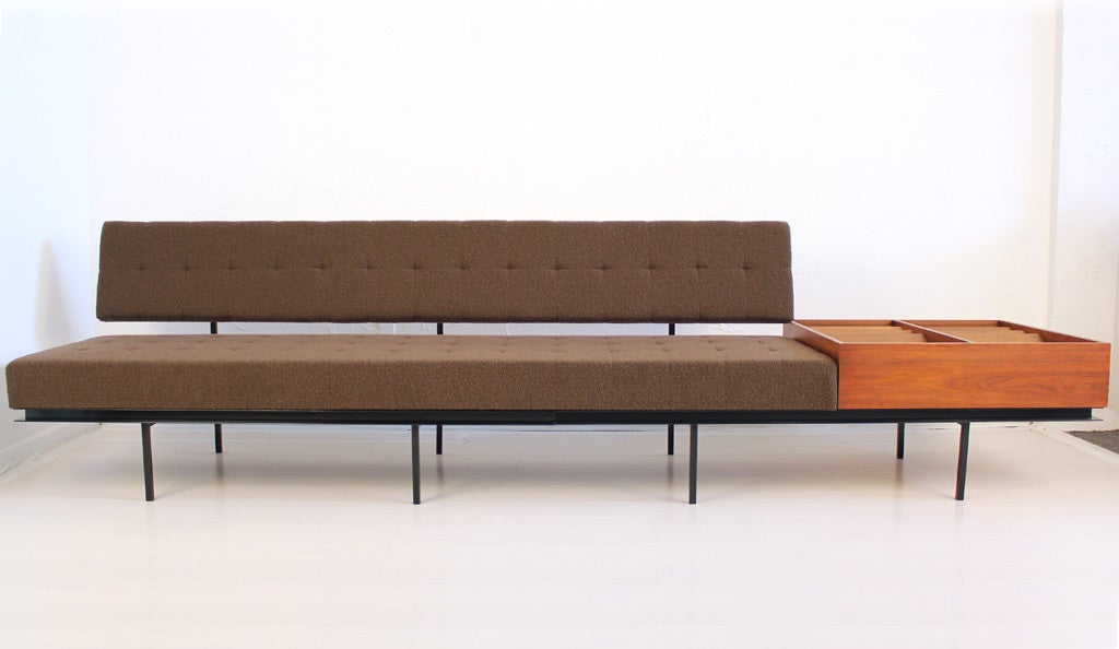 Florence Knoll sofa design circa 1954 with black steel framing and walnut magazine case. Newly upholstered in Knoll Boucle Pumpernickel fabric.

Overall length = 120