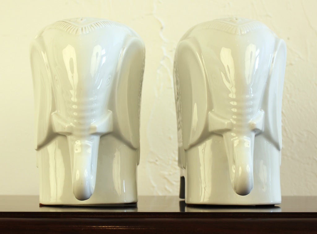 Pair of Chinese blanc de chine porcelain elephant bookends designed by Maitland-Smith. Retains original labels as pictured. Measurements are for each piece.