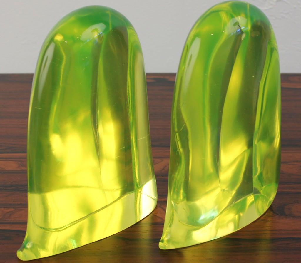 Large solid vaseline glass bookends from the Murano, Italy studio of Cenedese. Each piece measures 9