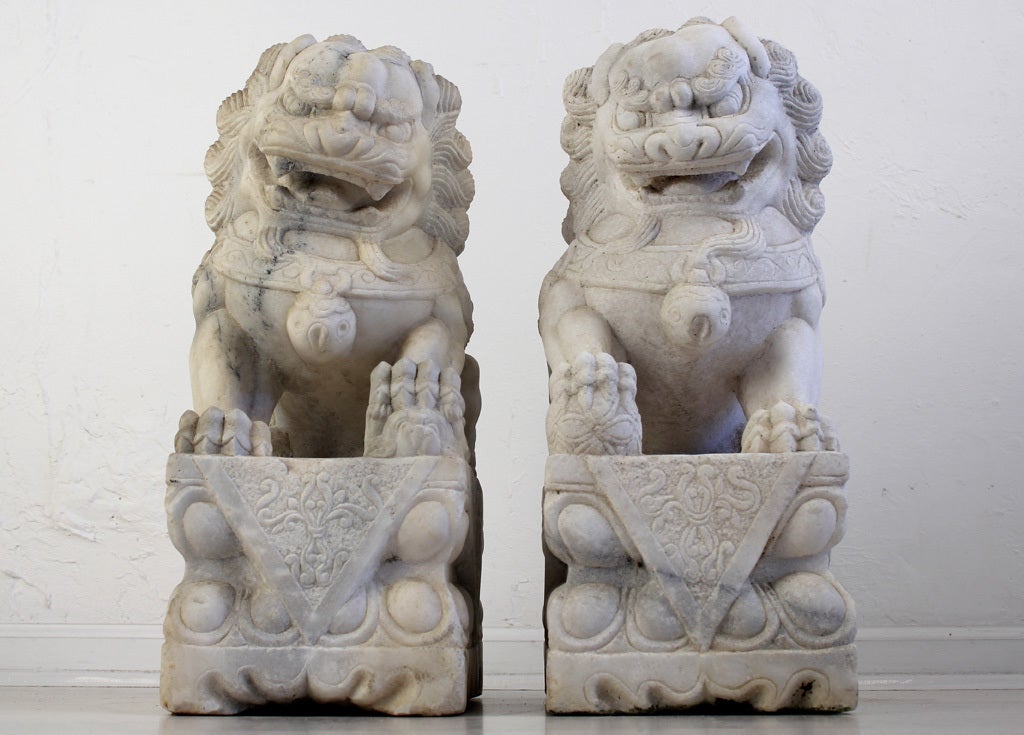 Pair of hand carved Chinese Marble Shizi Foo Lion/Dogs. This pair of statues has great detail and patina. Very heavy.

Measurements are for each piece.