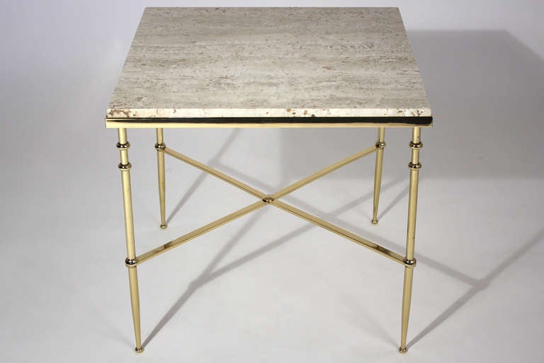 Elegant and simple polished brass side table with travertine top in the manner or Maison Jansen or Bagues.