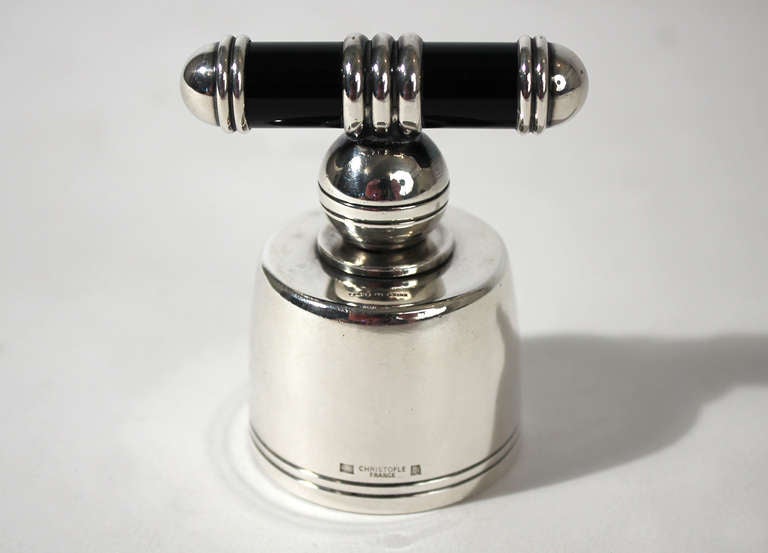 An uncommon silver plated art deco champaign cork or bottle stopper by Christofle with black lacquered handle. Made in France. Minor wear to surface and cork as pictured.