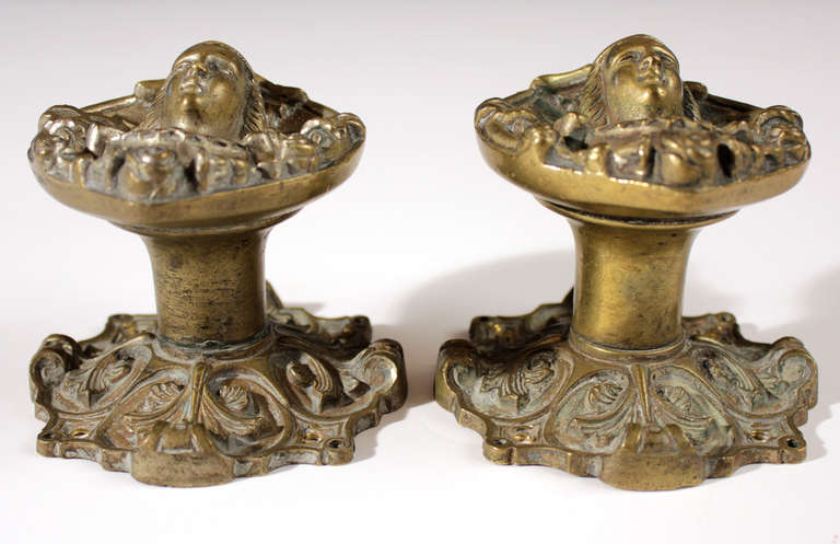 Pair of ornate Art Nouveau solid cast bronze door pulls or doorknobs. Each pull weighs just over 3 pounds. Nice patina and size.