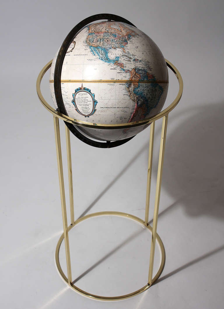 An elegant and simple design on this vintage 1970s floor standing globe with polished brass base. Stands 35.5