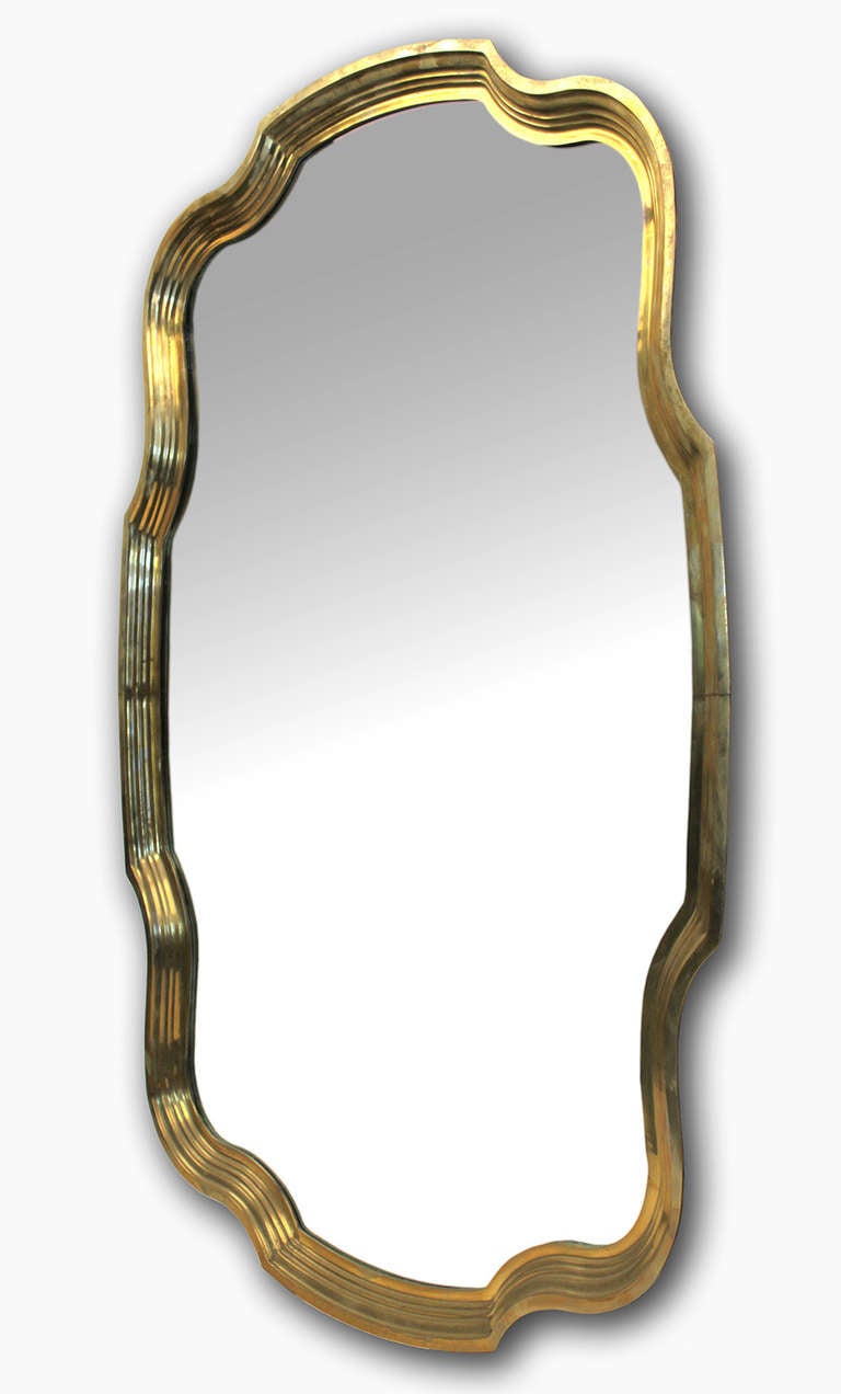 Scalloped edge solid brass wall hanging mirror by Baker.
