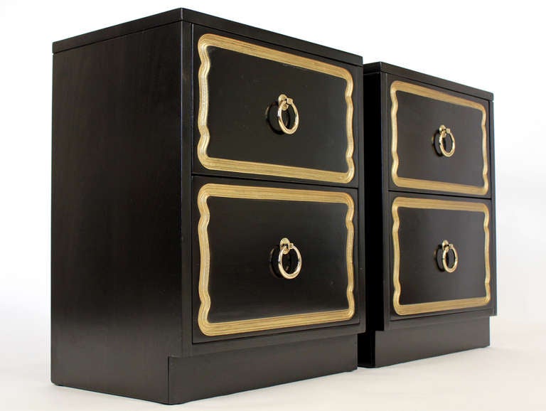 Dorothy Draper designed pair of small cabinets or night stands. Black lacquered and gold colored finish with brass finished pulls.

Measurements are for each piece.