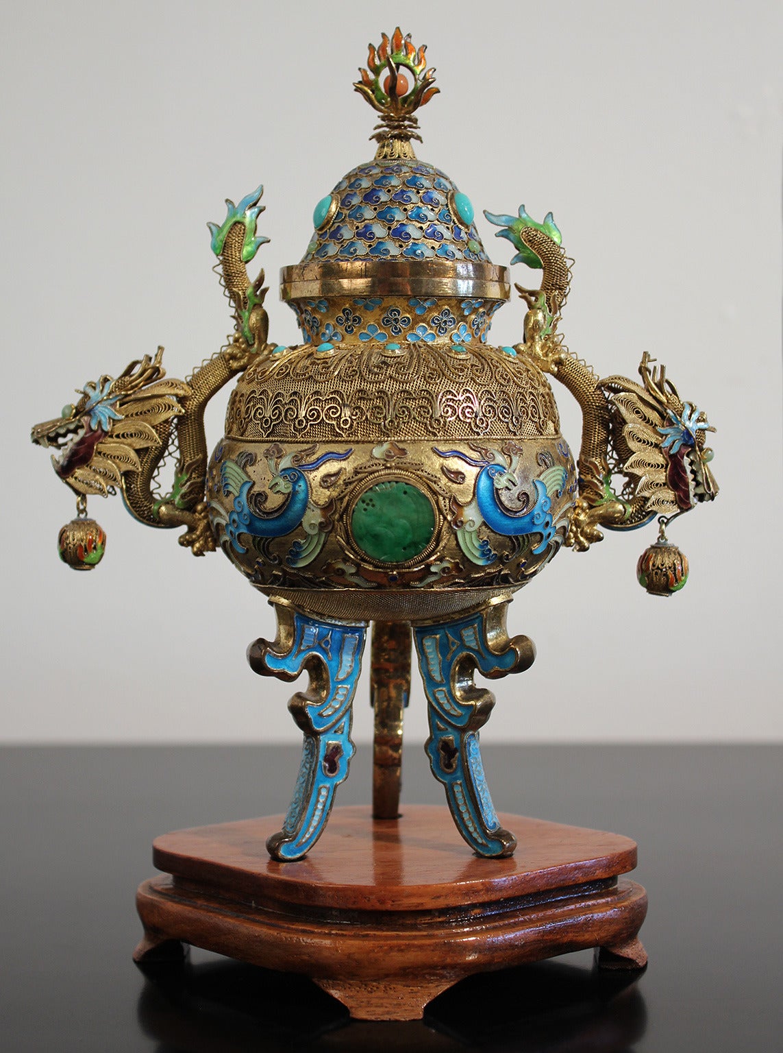 Expertly crafted solid sterling silver gold vermeil dragon censer. Handcrafted enamel work, carved jade panels on each side with turquoise and coral decoration. Comes with original footed wood stand.

Excellent condition with no damage, circa