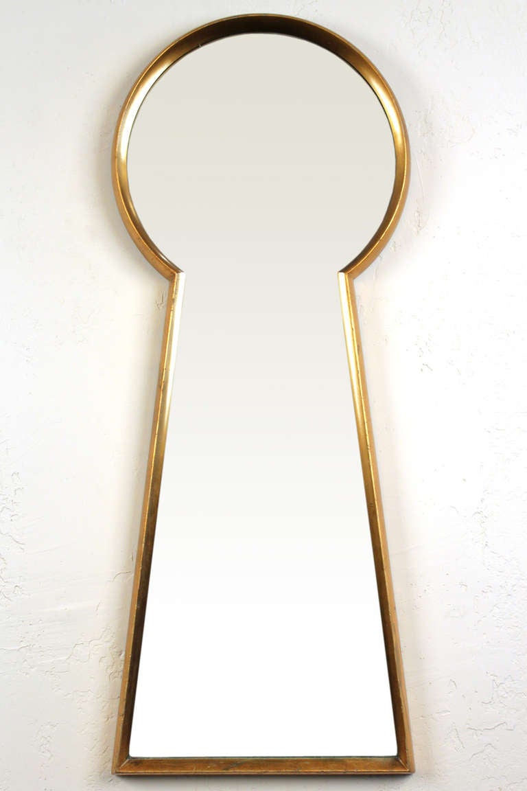 Gilt wood framed large keyhole shaped mirror measuring 48