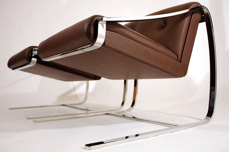 A rare and expertly crafted pair of lounge chairs in chocolate brown leather with solid polished bar steel cantilevered frames designed by Charles A Gibilterra for Glenn of California, 1971. Later manufactured by Brueton Furniture.

The spring