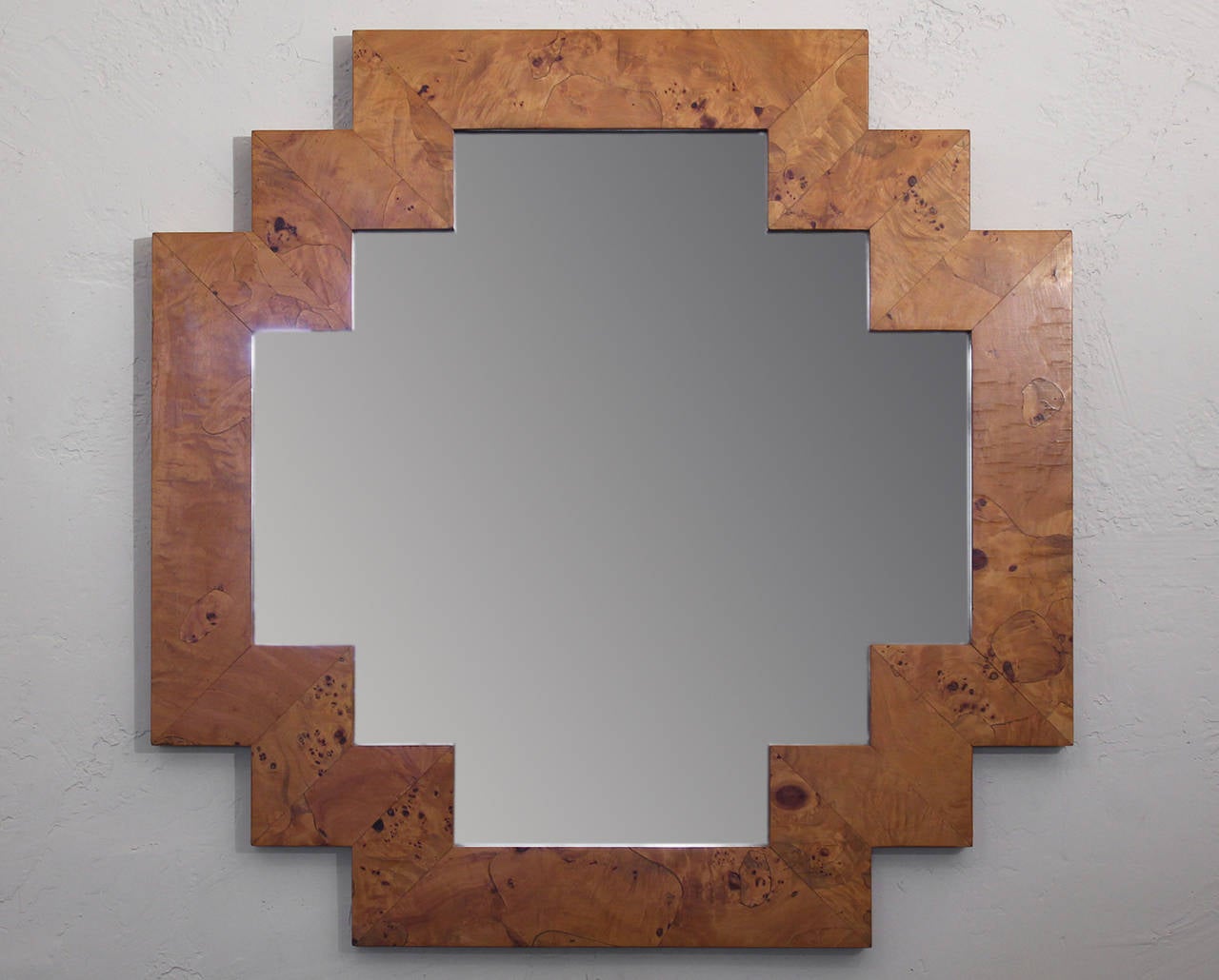 Art Deco style wall hanging mirror with a wonderful burl wood geometric frame. Made in Italy. Excellent vintage all-original condition with original finish.