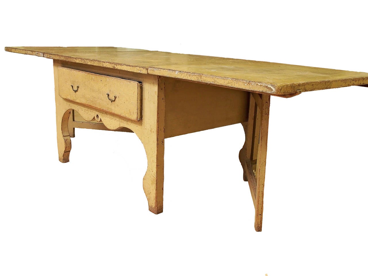 Beautiful oversized 18th century rustic Swedish country wooden farmhouse table. Original paint with aged ochre patina. Two drop-leafs with single drawer offers many possibilities for uses.

Dimensions: 29 3/4