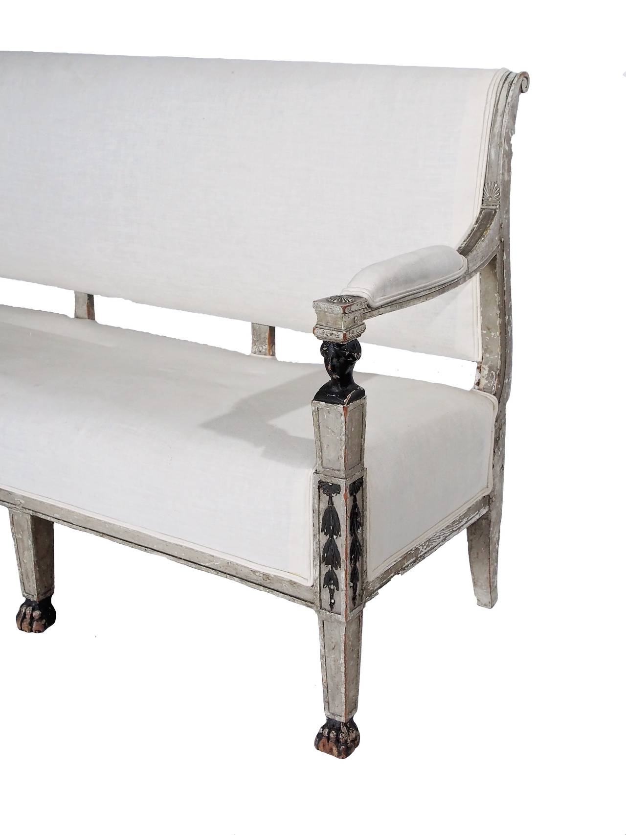 Gorgeous Canapé with Egyptian influence. Linen upholstery in creamy white color. Perfect for a narrow hallway.