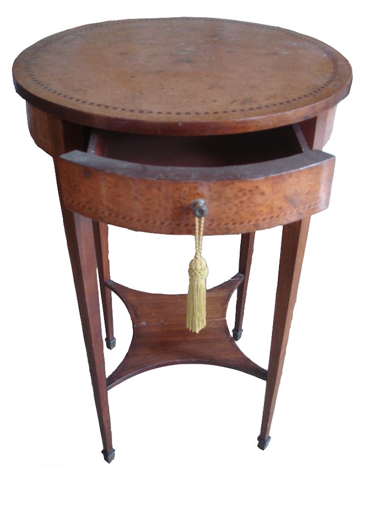 Tara Shaw Antiques - Fabulous side table or night stand. Wooden round shape with marquetry inlay and one drawer. Wear consistent with use and age. Wood crack and breakage at lower shelf. Scratches, wear and inlay fray and wood all over. Does not