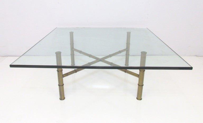 Minimalist in the manner of a Barcelona table, but with an elegant regency flair --an X-form coffee table in bronzed metal with faux bamboo legs and stretchers supporting a ¾” thick plate glass top.
 
 
