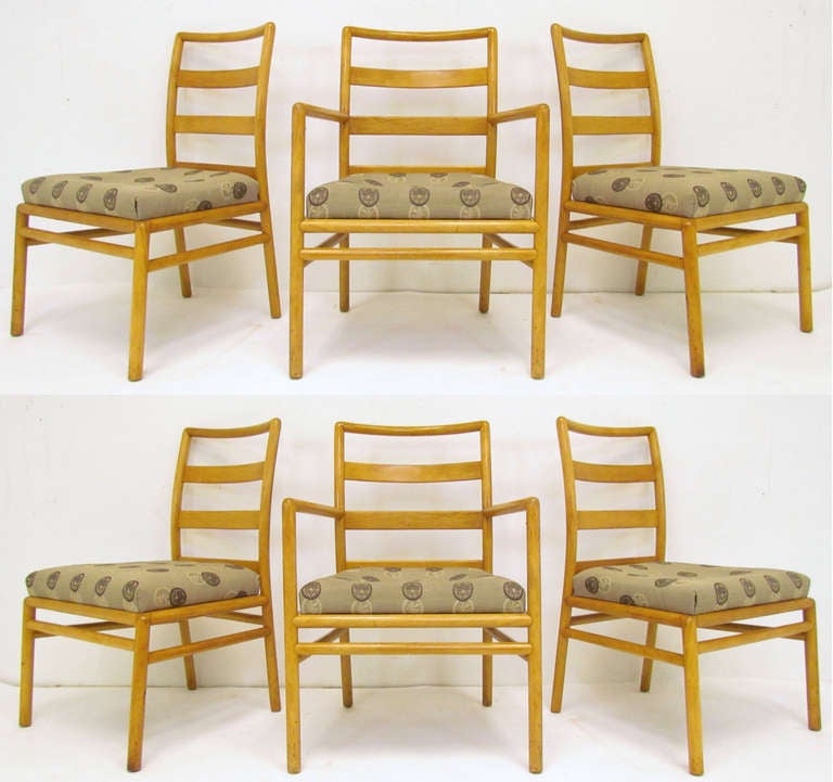 Set of six mid-century modern dining chairs designed by T.H. Robsjohn-Gibbings for Widdicomb, circa early 1950s.

The armchairs measure 23.5