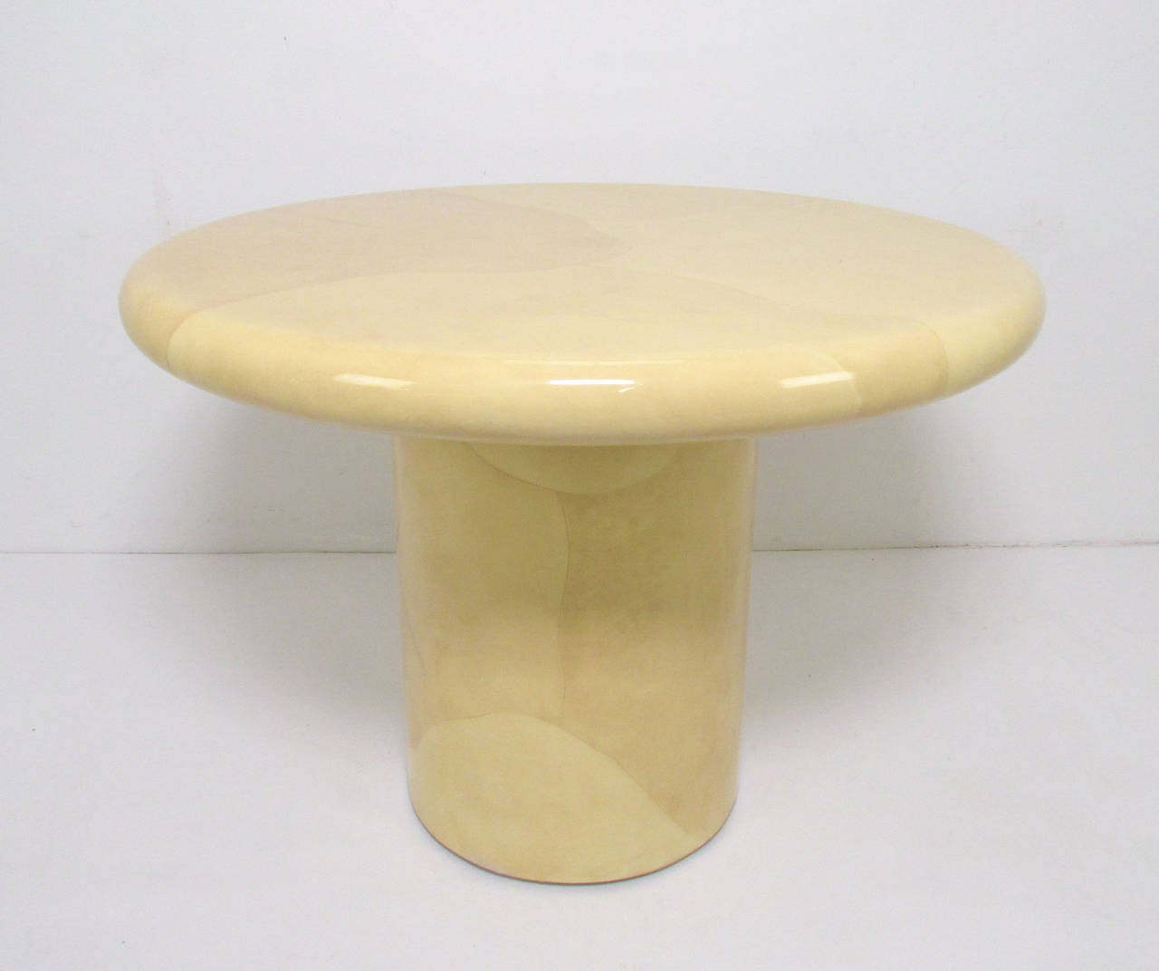 Lacquered faux goatskin dining or centerpiece table in the manner of Karl Springer, ca. 1970s.