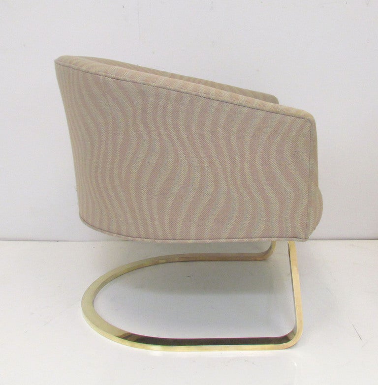 Pair of cantilever lounge chairs with tub form seats and solid brass bases, ca. 1970s.  In the manner of Milo Baughman for Thayer Coggin.