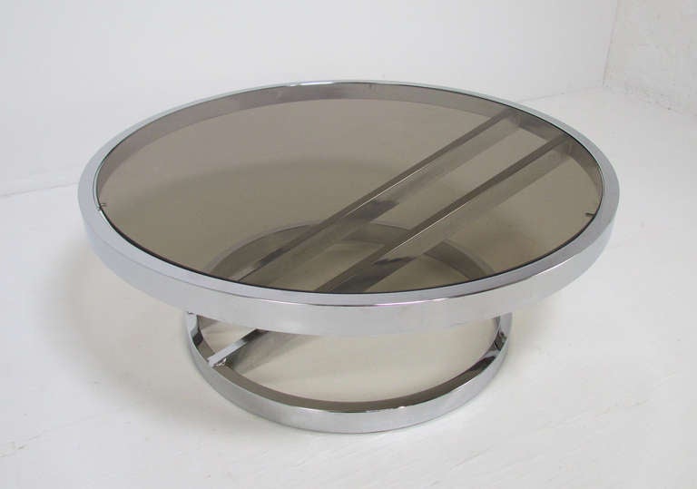 Classic modernist chrome and smoked glass coffee table with diagonally braced base, for Design Institute of America, ca. 1970s.