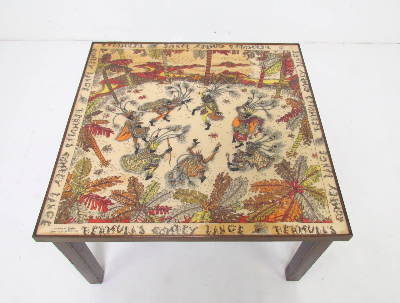 Novelty table with top featuring an early (circa 1940s) silk scarf by Emilio Pucci (for Guido Ravasi). Under heavy clear lacquer. Legs decorated in hand-painted gilt scrollwork in the Florentine manner. 

Some spills have leaked at edges to stain