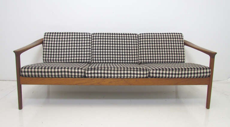 Carved teak mid-century modern sofa designed by Folke Ohlsson, for Dux, ca. early 1960s. Made in Sweden.