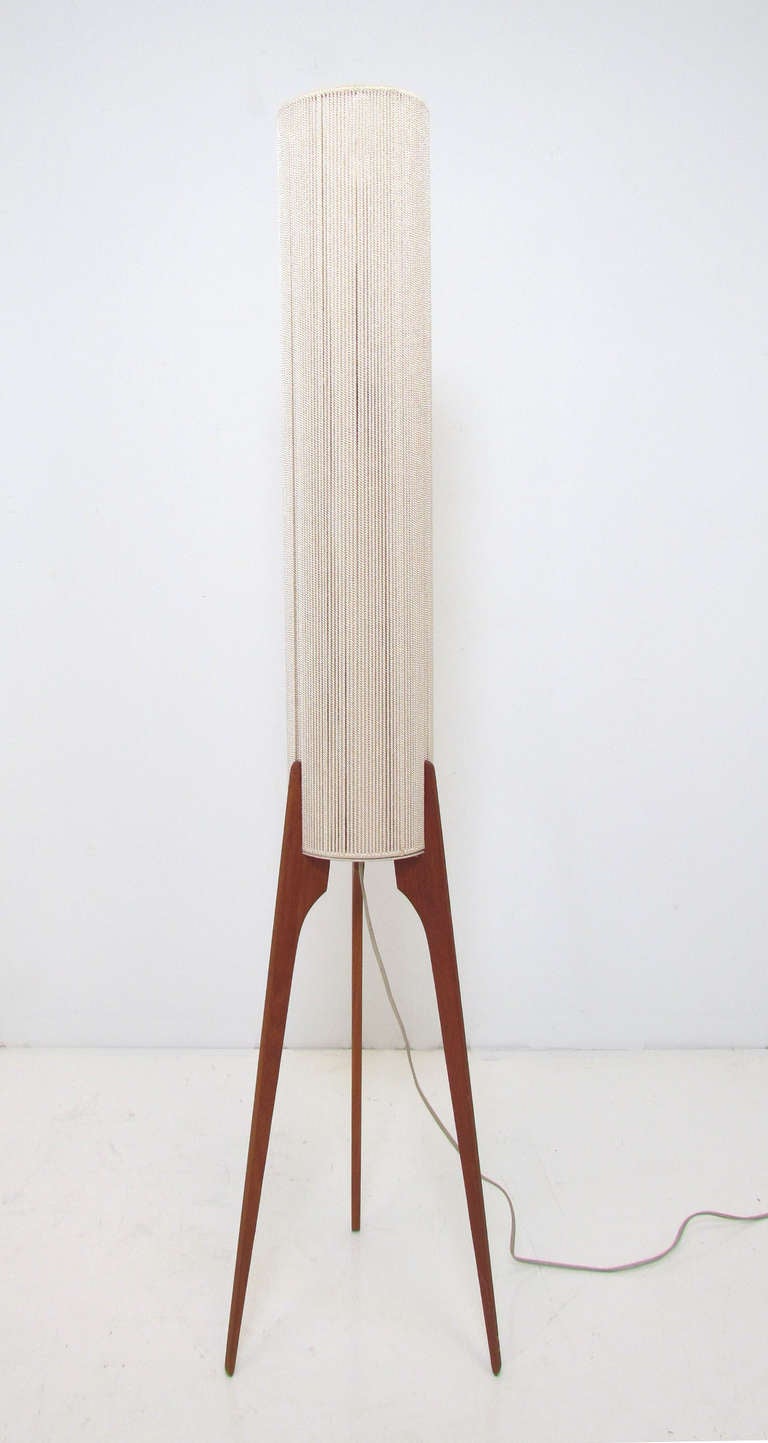 Danish teak tripod floor lamp with elongated cylindrical rope shade, ca. 1960s.   Unmarked, attributed to Fog & Morup.  Sleek 