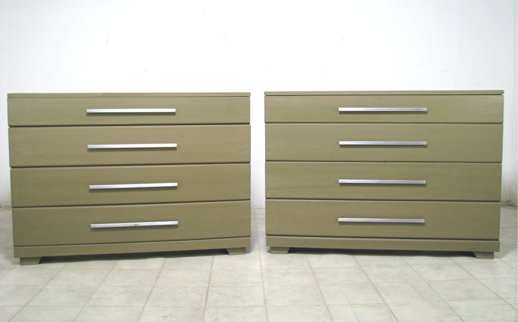 Pair of chests of drawers with sleek polished aluminum pulls designed by Raymond Loewy for Mengel, ca. 1950s.  Each chest of drawers features one drawer at 3 ½” deep, three drawers at 5 ½” deep.