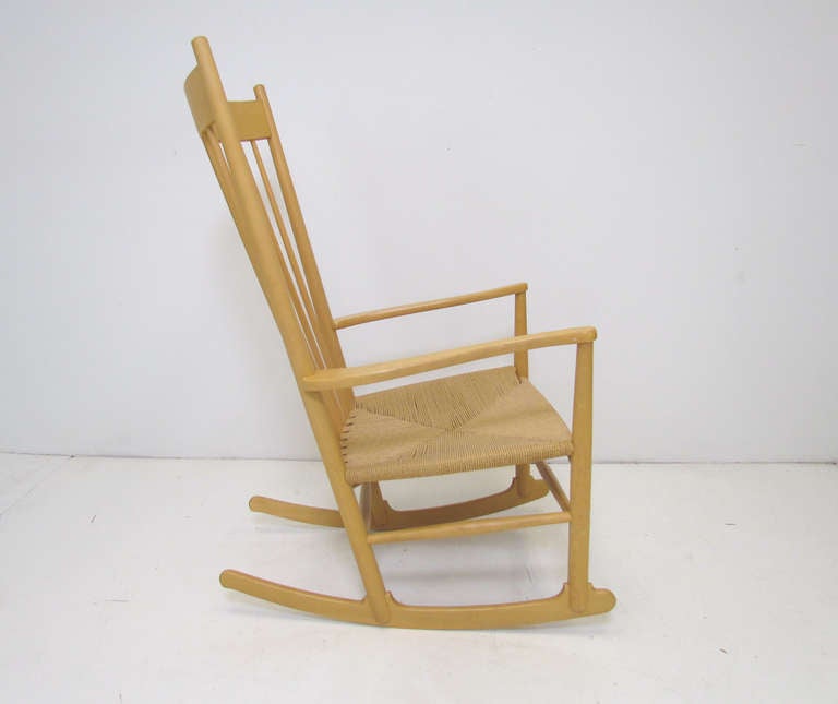Hans Wegner “J16” rocker with corded seat for FDB Mobler, Denmark.  First created in 1944, this has been one of Wegner’s most widely recognized  and enduring designs. This vintage rocking chair is marked with a production date of 1976.