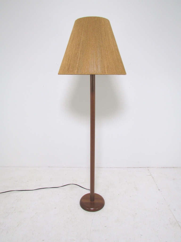 Danish modern teak pole floor lamp with vintage jute cord shade, ca. 1960s.  Most likely  made in Sweden for Kovacs.

57