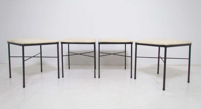 Set of four modernist stools with black enameled steel 