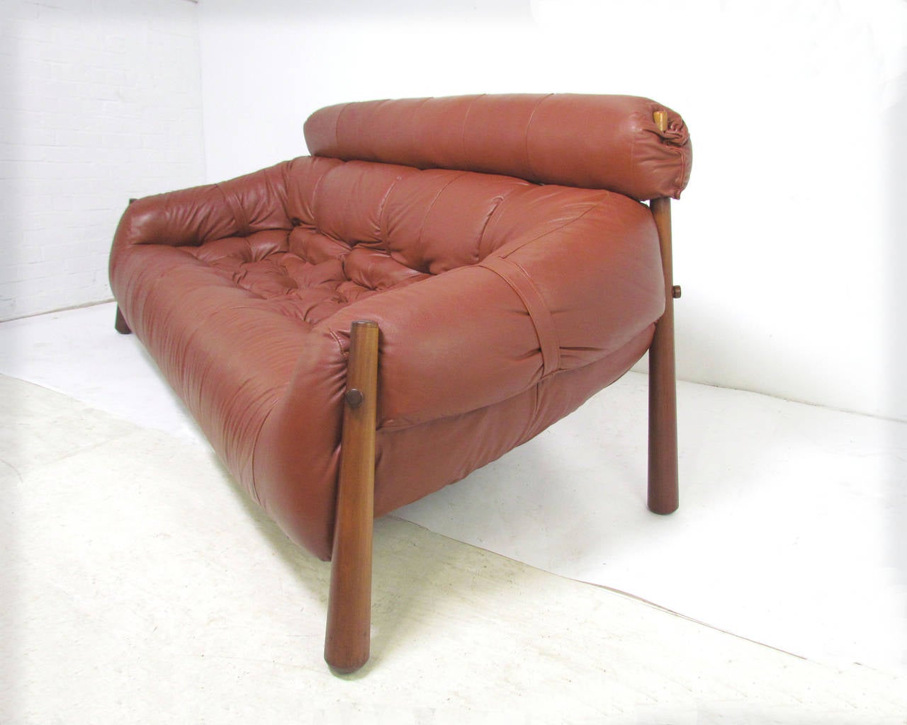 Sofa in leather designed by Percival Lafer for Lafer S.A. Industries, Brazil, circa 1958. Reverse tapered splayed legs in jacaranda (Brazilian rosewood). 

A virtual time capsule in terms of condition, this piece was kept covered by the original