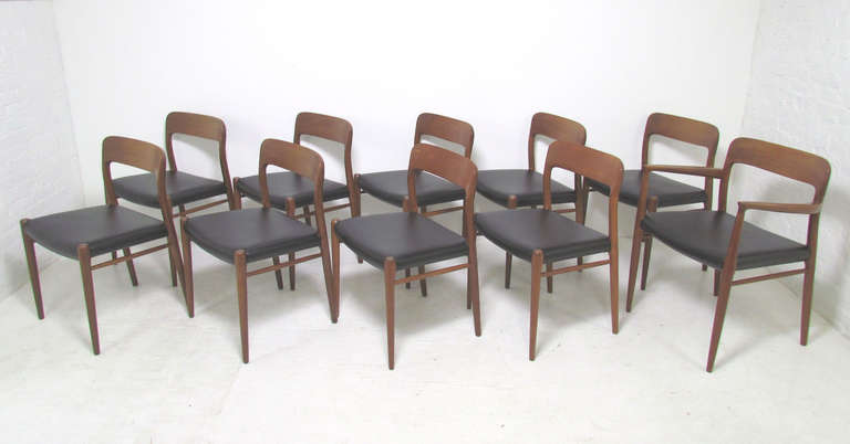 Set of ten classic teak dining chairs with carved seat backs by Niels Moller for JL Moller, Denmark, circa 1960s. Set includes one arm chair and nine side chairs.  Price is for the set.

Prior owner added to original set over the years as family