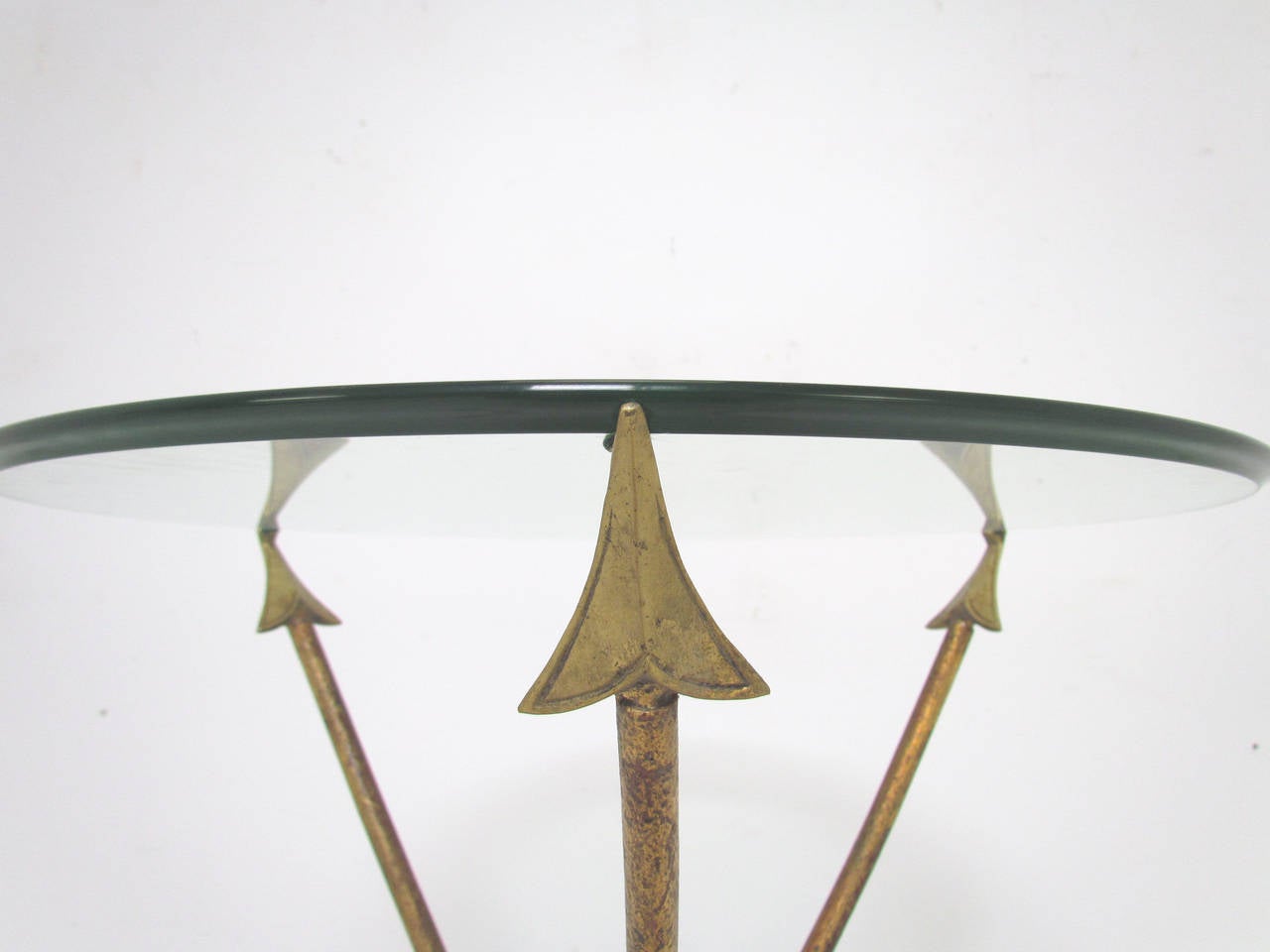 Mid-century side table with tripod base consisting of gilded brass 