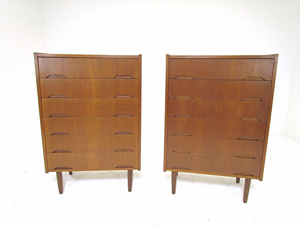 Matched pair of Danish teak dressers with trapezoidal inset hand pulls, by Svend Langkilde, ca. 1950s.