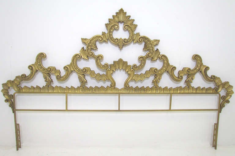 Vintage mid-century gilt metal headboard for a king size bed, in the Louis XV French Rococo style.    Ca. late 1940s or early 1950s, the height of Hollywood Regency style.

Overall length is 87.25