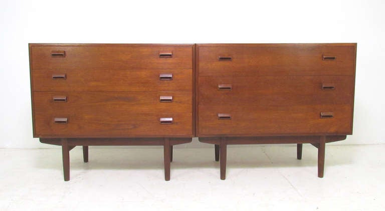 Pair of Danish teak chests by Borge Mogensen.  One is a four drawer dresser. The other with three drawers, one of which features a drop down drawer front which ingeniously becomes a pull out desk  / vanity with storage cubbies, open shelves, and a
